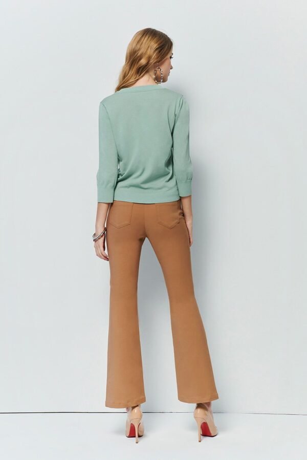 Flared pants with asymmetrical hem breasted